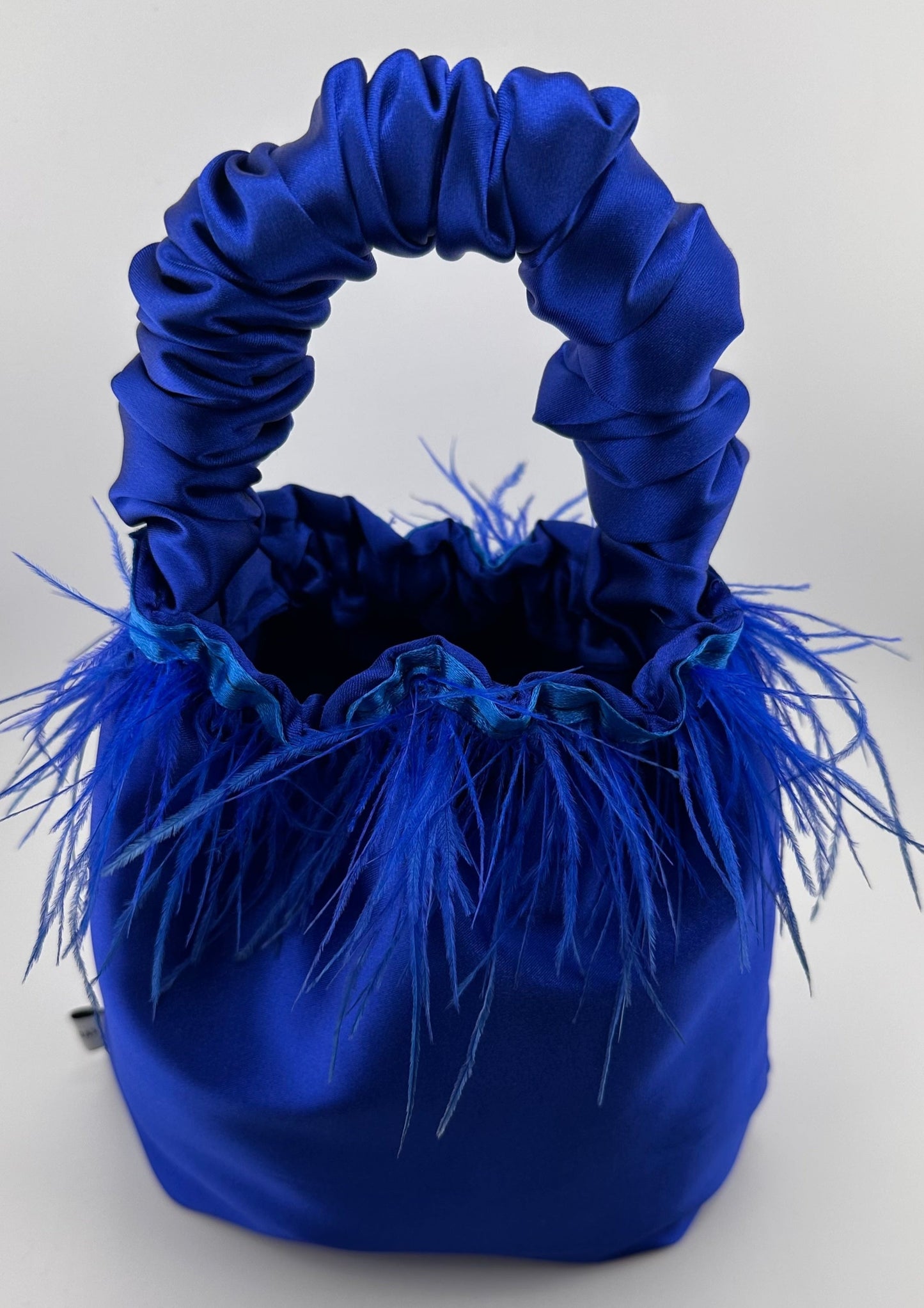<tc>Royal Blue Satin Scrunchie Bag with Feathers</tc>