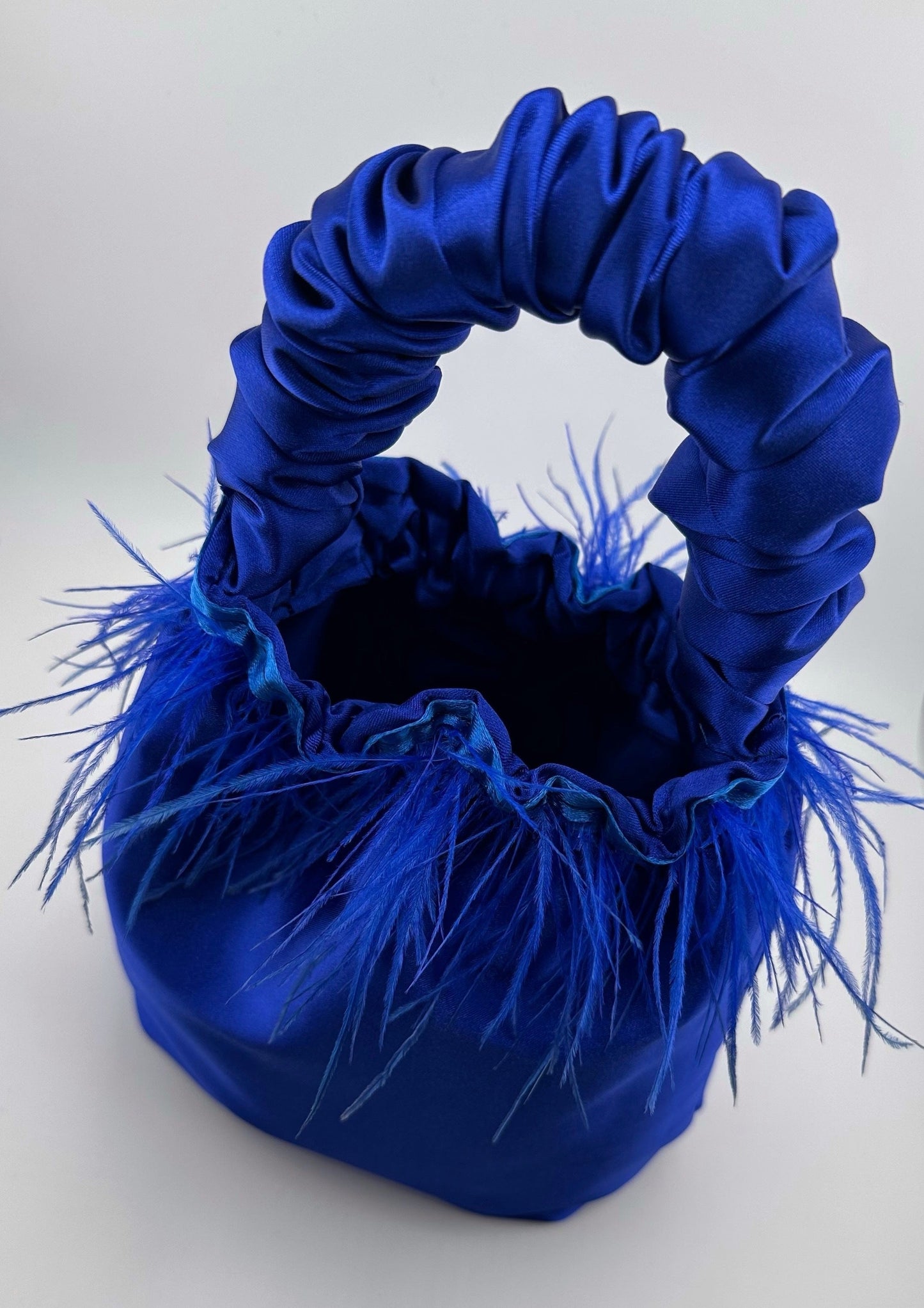 <tc>Royal Blue Satin Scrunchie Bag with Feathers</tc>