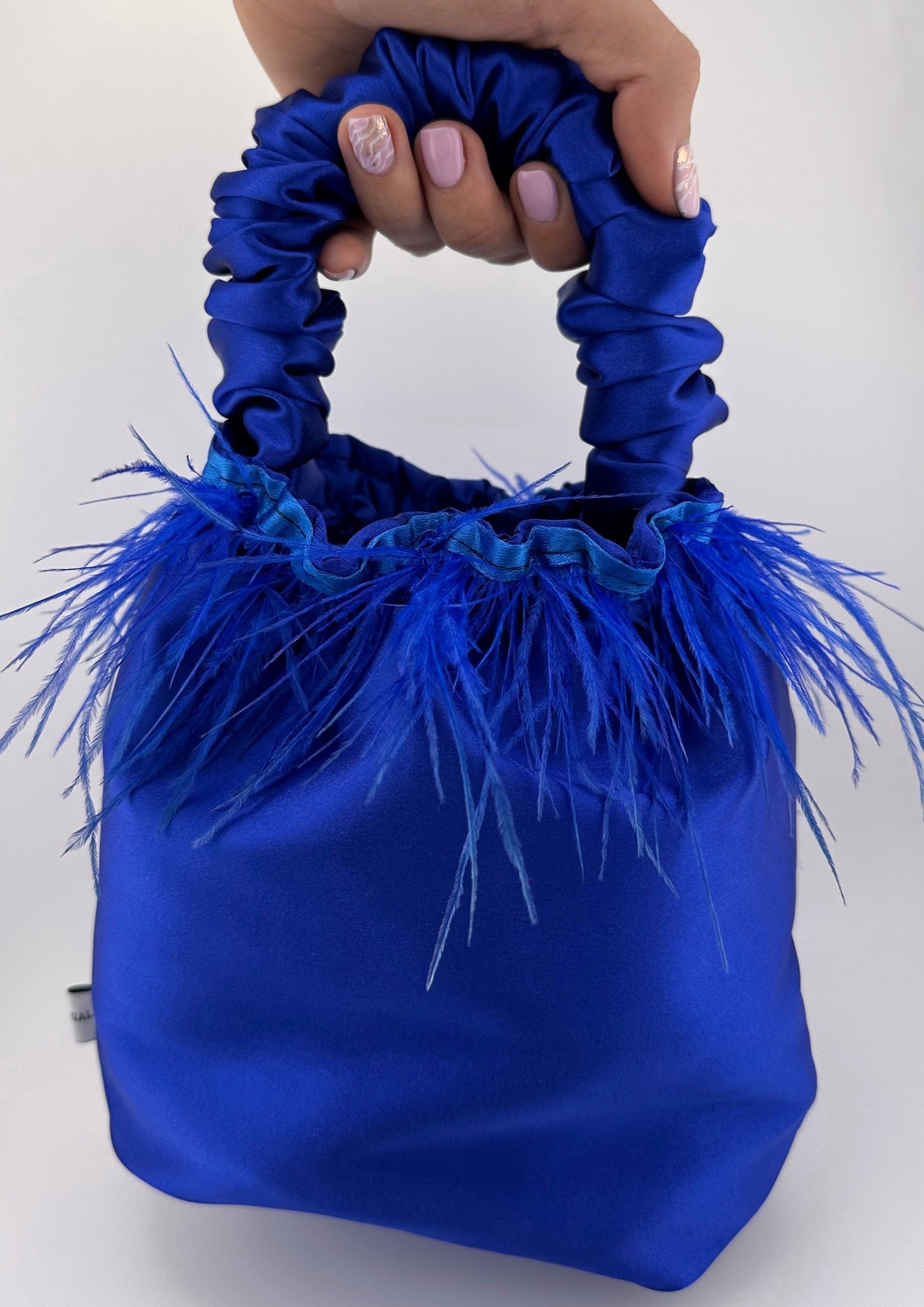 <tc>Royal Blue Satin Scrunchie Bag with Feathers</tc>